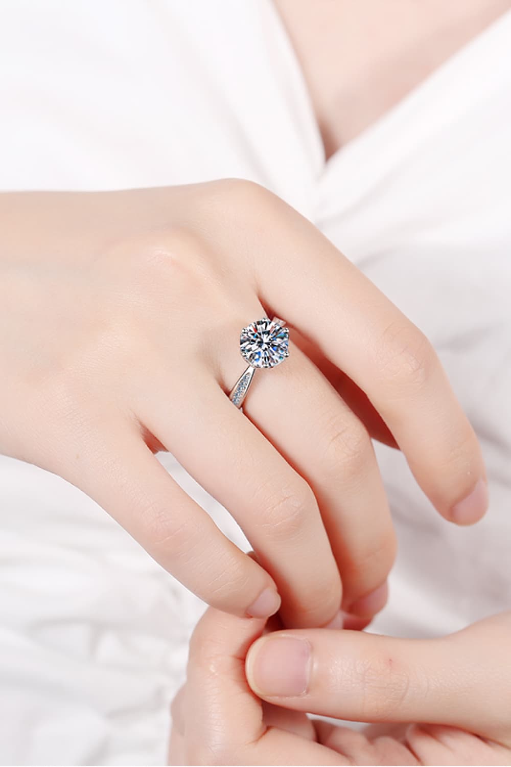 3 Carat Moissanite Rhodium-Plated Side Stone Ring worn on a hand showcasing its minimalist design.