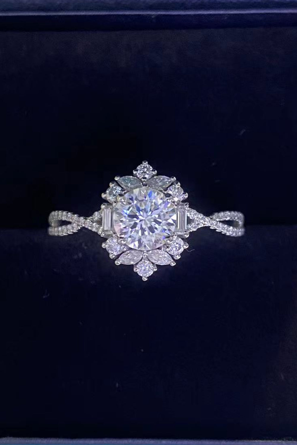 Floral 2 Carat Moissanite Crisscross Engagement Ring featuring a stunning flower design with sparkling stones.