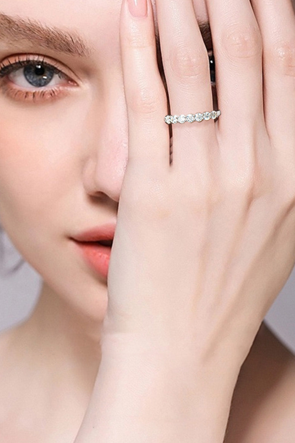 Model showcasing the Can't Stop Your Shine Moissanite Platinum-Plated Ring on her hand.