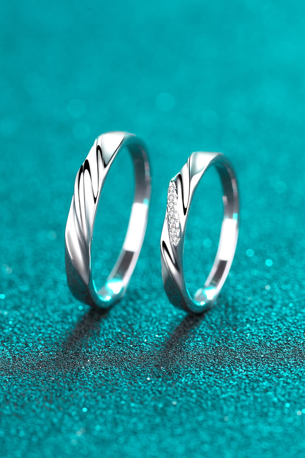Minimalist 925 Sterling Silver Rhodium-Plated Ring displayed on a sparkling teal background.