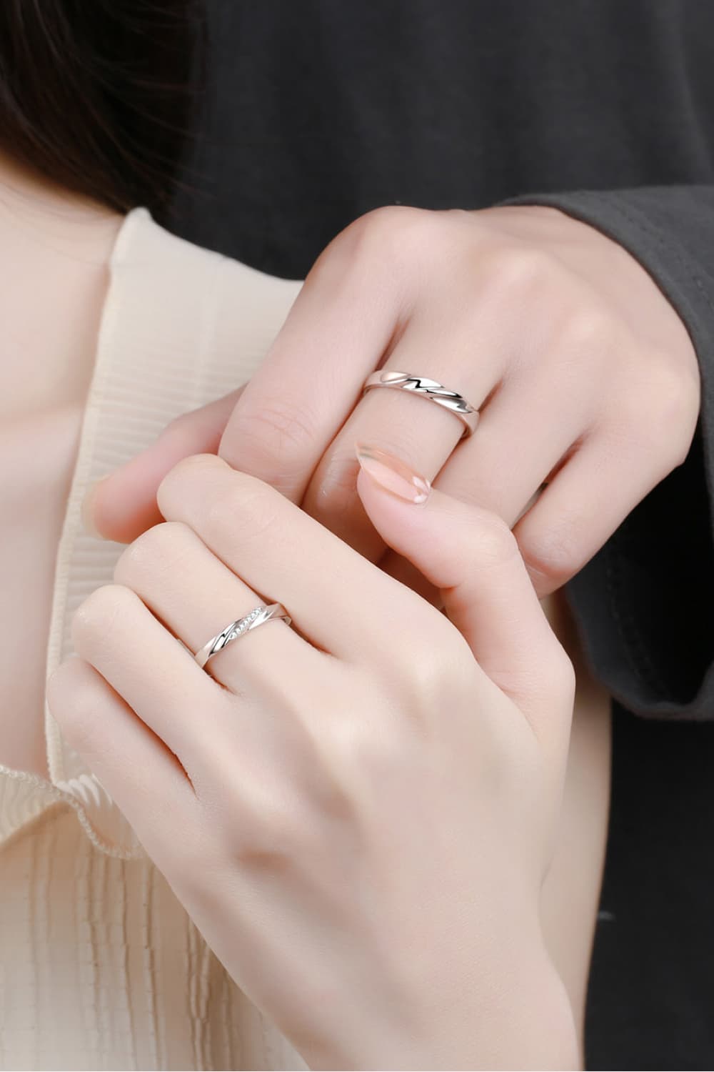 Couple wearing Minimalist 925 Sterling Silver Rhodium-Plated Rings, showcasing elegance and style.